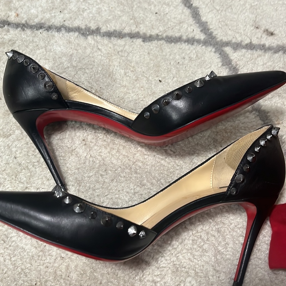 Authentic Louboutin black leather with gunmetal spikes. Size 7